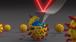 La punta del AFM, que está al final del cantiléver, escarba en un rotavirus para acceder a todas sus capas de proteína, mientras que el láser mide la fuerza que hay que aplicar